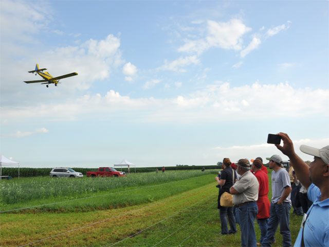 A plane demonstrates aerial seeding of cover crops as part of the Conservation Technology Information Center tour  of the Indian Creek Watershed in Illinois last week. (DTN photo by Chris Clayton)